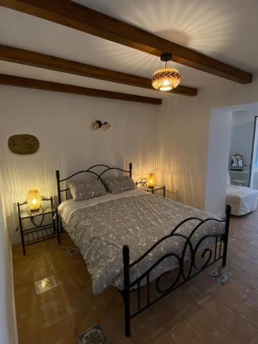 a bedroom with a bed with two lamps on it at Sunny Aljezur da Misericórdia, Aljezur, Costa Vicentina in Aljezur