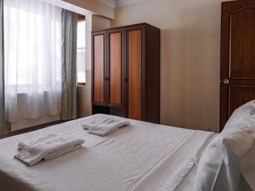 Ένα ή περισσότερα κρεβάτια σε δωμάτιο στο Güre Saruhan Termal Otel
