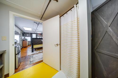 a hallway with a barn door and a living room at The Little Giant, Converted Railcar in DuBois! in Adrian Furnace