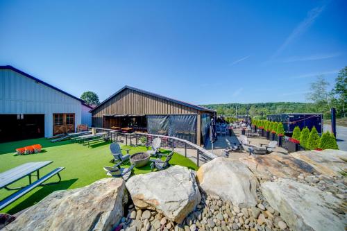 a park with rocks and chairs and a building at The Little Giant, Converted Railcar in DuBois! in Adrian Furnace