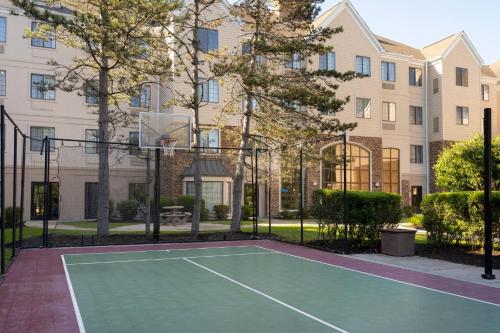 a tennis court in front of a building at Staybridge Suites Boston - Burlington by IHG in Burlington