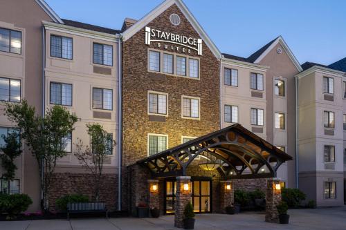 a rendering of the savoy hotel at dusk at Staybridge Suites Boston - Burlington by IHG in Burlington