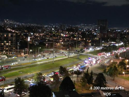 a city lit up at night with lots of traffic at Hotel Castellana 95 Bogota By Hoteles Confort 80 in Bogotá