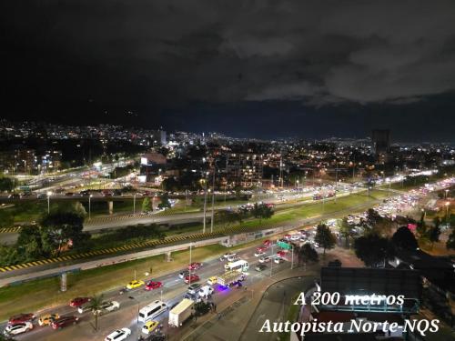 a busy city street with traffic at night at Hotel Castellana 95 Bogota By Hoteles Confort 80 in Bogotá