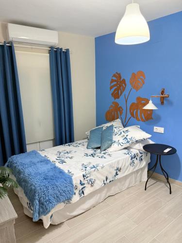 Ένα ή περισσότερα κρεβάτια σε δωμάτιο στο El Boulevard de Trujillo 1997