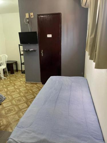 Ένα ή περισσότερα κρεβάτια σε δωμάτιο στο Pousada Zenite