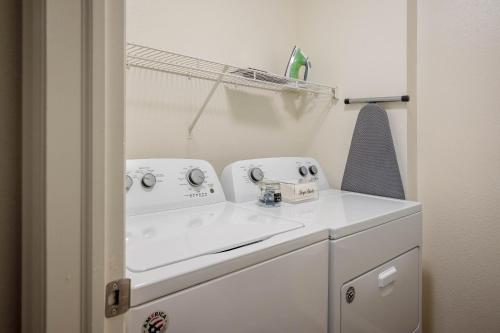a bathroom with a white sink and a mirror at Relaxing Place Close to Skiing in Midvale