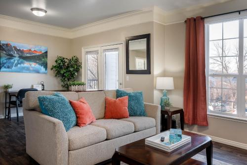 a living room with a couch and a table at Relaxing Place Close to Skiing in Midvale