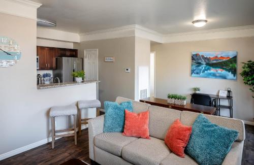 a living room with a couch with colorful pillows at Relaxing Place Close to Skiing in Midvale