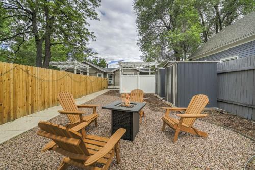 a backyard with chairs and a grill and a fence at Euro Cottage - Downtown Convenience BBQ Fire Pit in Colorado Springs