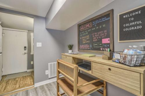 a dining room with a desk and a chalkboard at Euro Cottage - Downtown Convenience BBQ Fire Pit in Colorado Springs