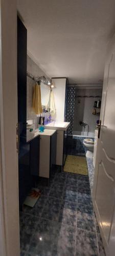 a small bathroom with a sink and a tub at Comfortable and Elegant apartment FoFi in Thessaloniki