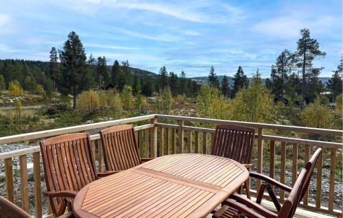 a wooden chair sitting on a wooden deck at 2 Bedroom Beautiful Home In Gålå in Gålå