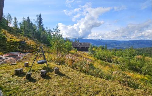 a view of a hill with a house in the distance at Awesome Home In Eggedal With Sauna in Eggedal