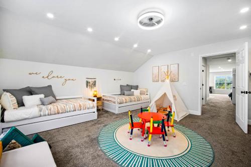 a living room with a table and a couch at Luxury Mountain Retreat with Main House and Garage Apartment. Perfect for Families, Retreats and Remote Work in Sparta