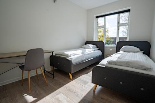Postel nebo postele na pokoji v ubytování Holstebro Apartments