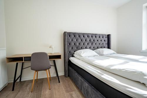 Postel nebo postele na pokoji v ubytování Holstebro Apartments