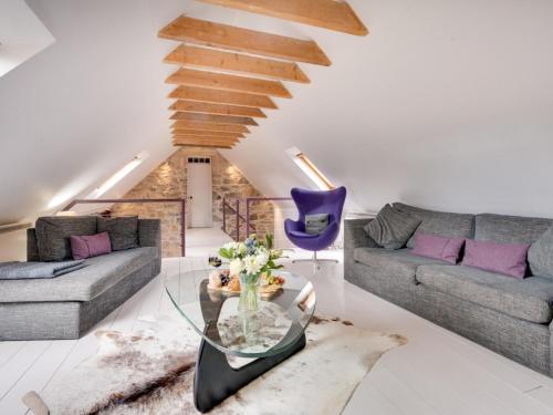 a living room with two couches and a glass table at 5 Bed in Selkirk TOWER in Selkirk