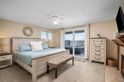 a bedroom with a bed and a dresser and a window at Beachfront Family Sanctuary in Rockaway Beach