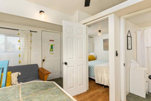 a small bedroom with a bed and a couch at Sea Haven Motel Unit .7 in Rockaway Beach