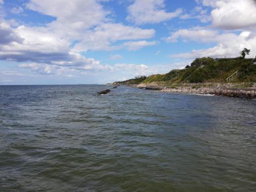 a large body of water next to a beach at 4 star holiday home in Asperup in Asperup