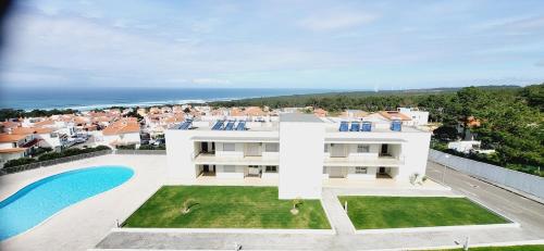 an aerial view of a house with a swimming pool at Marco Polo Apartment in Nazaré