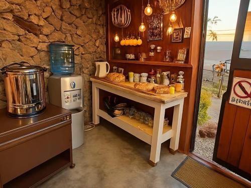 a kitchen with a counter with bread on it at Bosveld In Die Stad Lodge in Alberton