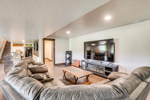 a living room with two couches and a tv at 4 Mi to Dtwn Sturgis Cabin with Hot Tub and Game Room in Crook City