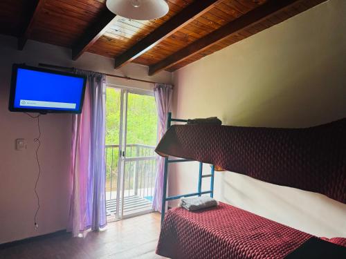 Postel nebo postele na pokoji v ubytování Casa con bajada al Río Potrero de los funes