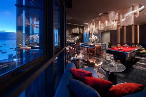a room with a pool table and a room with a pool table at The Edge Infinity in Pattaya