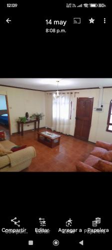 a living room with a couch and a table at Arriendo de habitación amobladas centro de la ciudad de la serena chile in La Serena