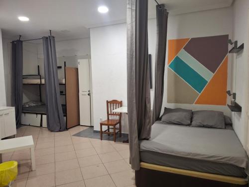 Postel nebo postele na pokoji v ubytování Hostel Duque Rivas
