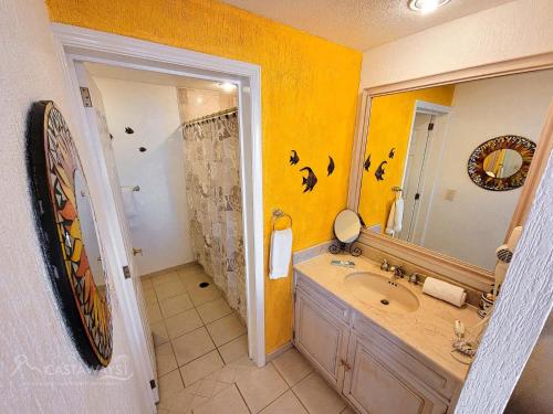 a bathroom with a sink and a mirror and a shower at Sonoran Spa E509 in Campo del Medio
