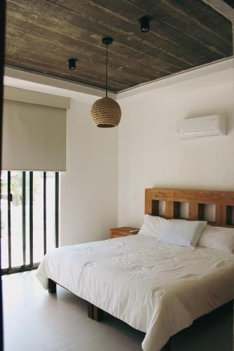 Postel nebo postele na pokoji v ubytování Casa Calec: Dpto B. con piscina/2 min. playa