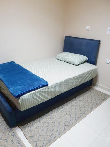 En eller flere senge i et værelse på Andy Guest House Pyramids View