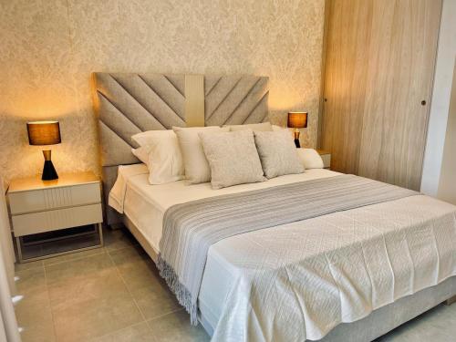 Katil atau katil-katil dalam bilik di Apartasuite con vista al mar y acceso a la playa