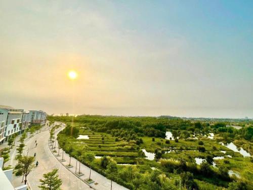 a view of a park with the sun in the sky at The Kind Villas Phu Quoc in Phu Quoc