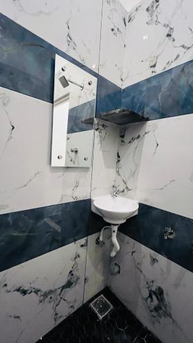 a black and white bathroom with a sink at The Chalet - Cozy Villa with Mini Pool, near Eden Blue Flag Beach, Pondicherry - JR Groups in Puducherry