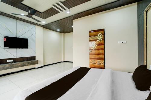 Hotel O Golden wingsにあるテレビまたはエンターテインメントセンター