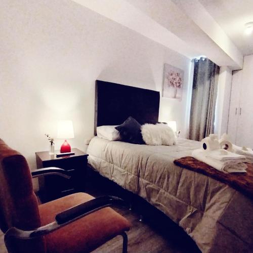 En eller flere senge i et værelse på Torre Vallecito