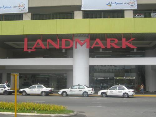 a mall with police cars parked in front of it at Vietnam Theme Kamuning MRT GMA 7 EDSA Veranda Pool Gym Netflix in Manila