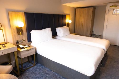 a large white bed in a hotel room at Dover Marina Hotel & Spa, Tapestry Collection by Hilton in Dover