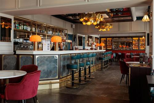 a bar with chairs and a counter in a restaurant at Dover Marina Hotel & Spa, Tapestry Collection by Hilton in Dover