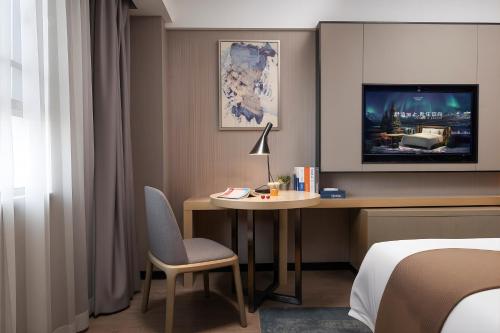 Postel nebo postele na pokoji v ubytování Echarm Hotel Chengdu Chunxi Road IFS Center