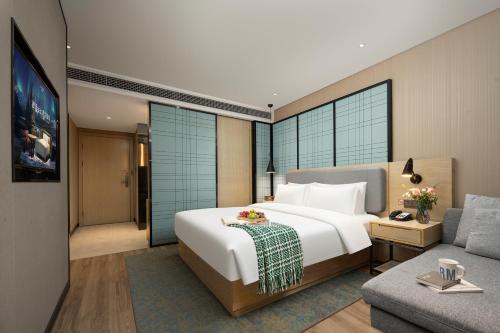 Postel nebo postele na pokoji v ubytování Echarm Hotel Chengdu Chunxi Road IFS Center