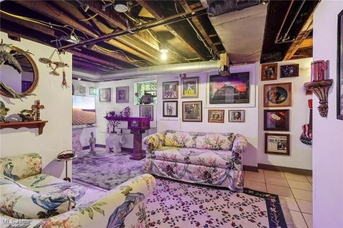 a living room with a couch and a table at The Boulevard Stay in Cleveland