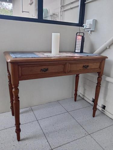 a wooden table in a room with a mirror at The Deyzel house in Durban