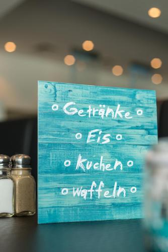 two salt and pepper shakers sitting on top of a table at Rheinterrassen Hotel Café Restaurant in Widdig