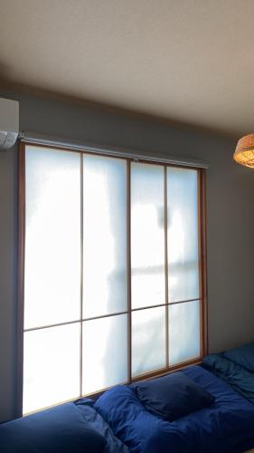 Ένα ή περισσότερα κρεβάτια σε δωμάτιο στο NEGAU House