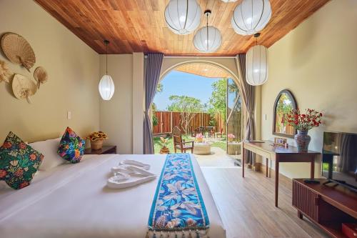 Postel nebo postele na pokoji v ubytování LuA House Hoian